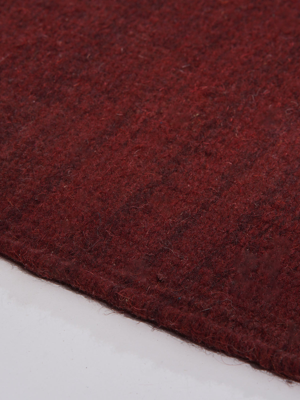 hand-woven-flat-weave-kilim-wool-solid-burgundy-rug-closeup-2