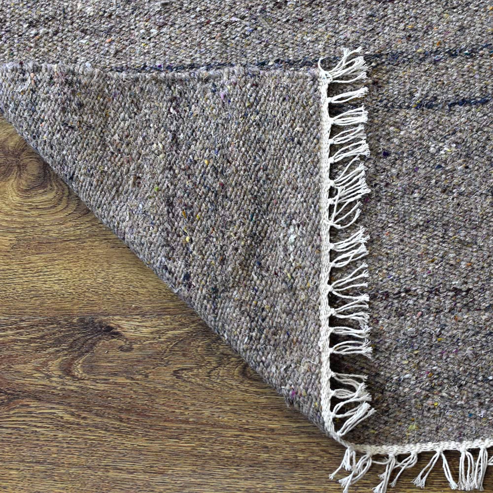 hand-woven-flat-weave-polyester-solid-beige-rug-closeup-3