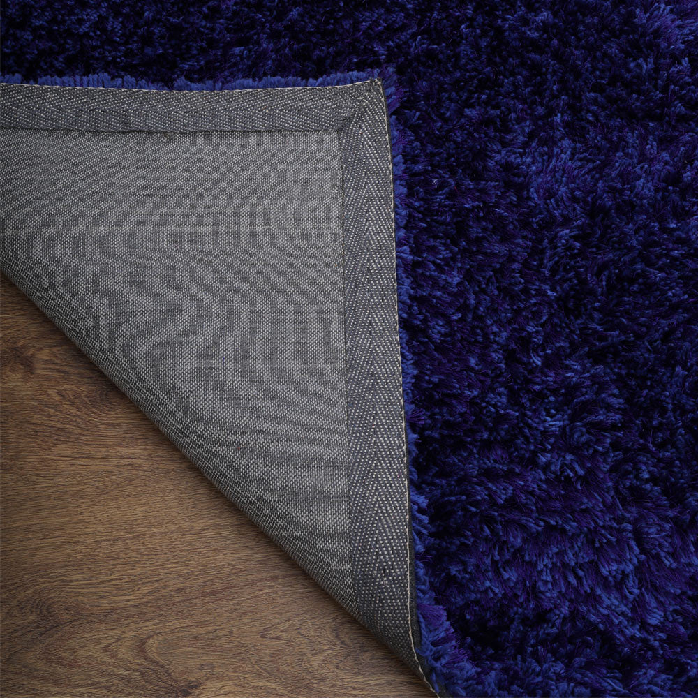 hand-tufted-shag-polyester-area-rug-solid-blue-closeup 5