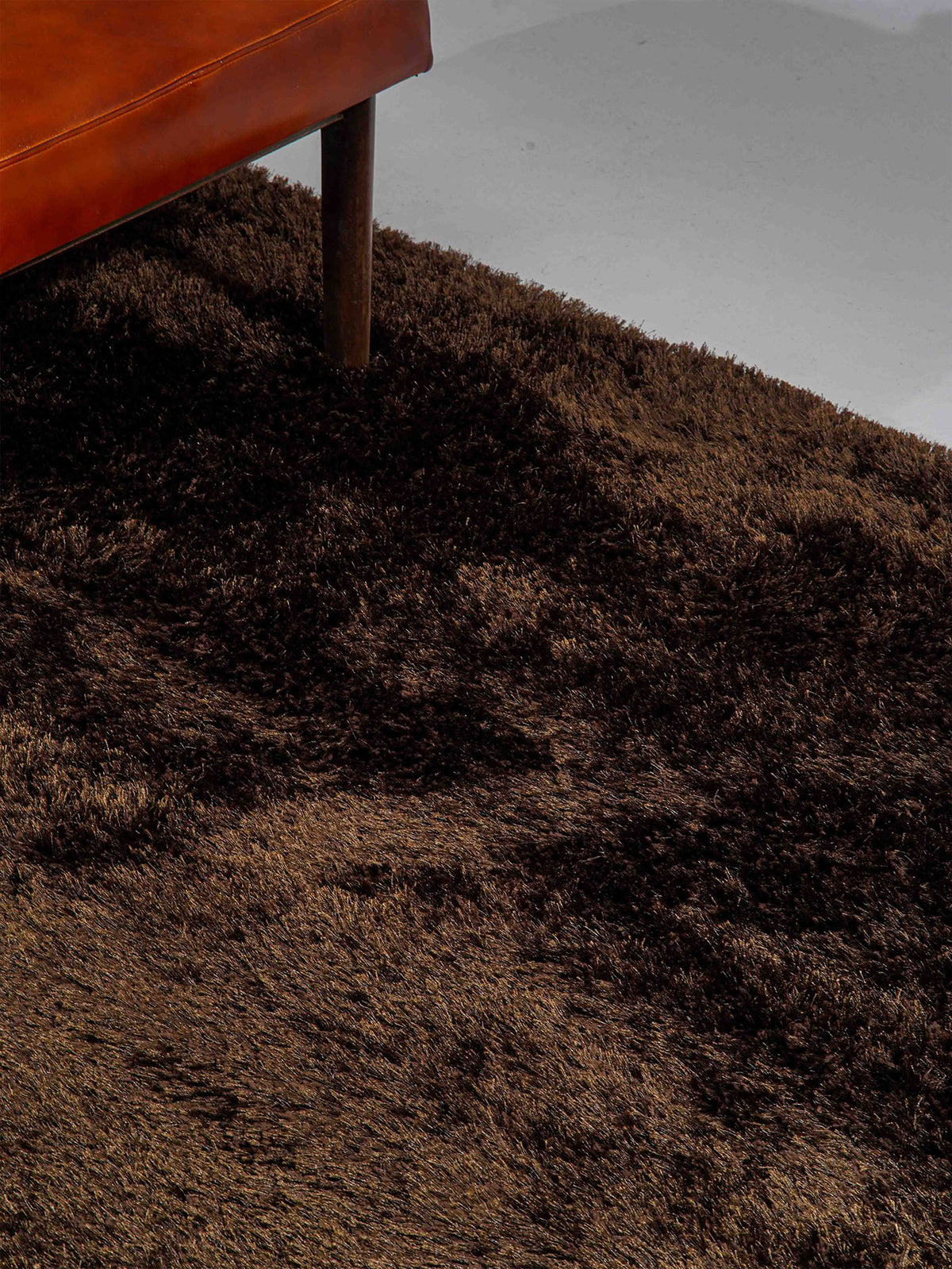hand-tufted-shag-polyester-area-rug-solid-brown-closeup 1