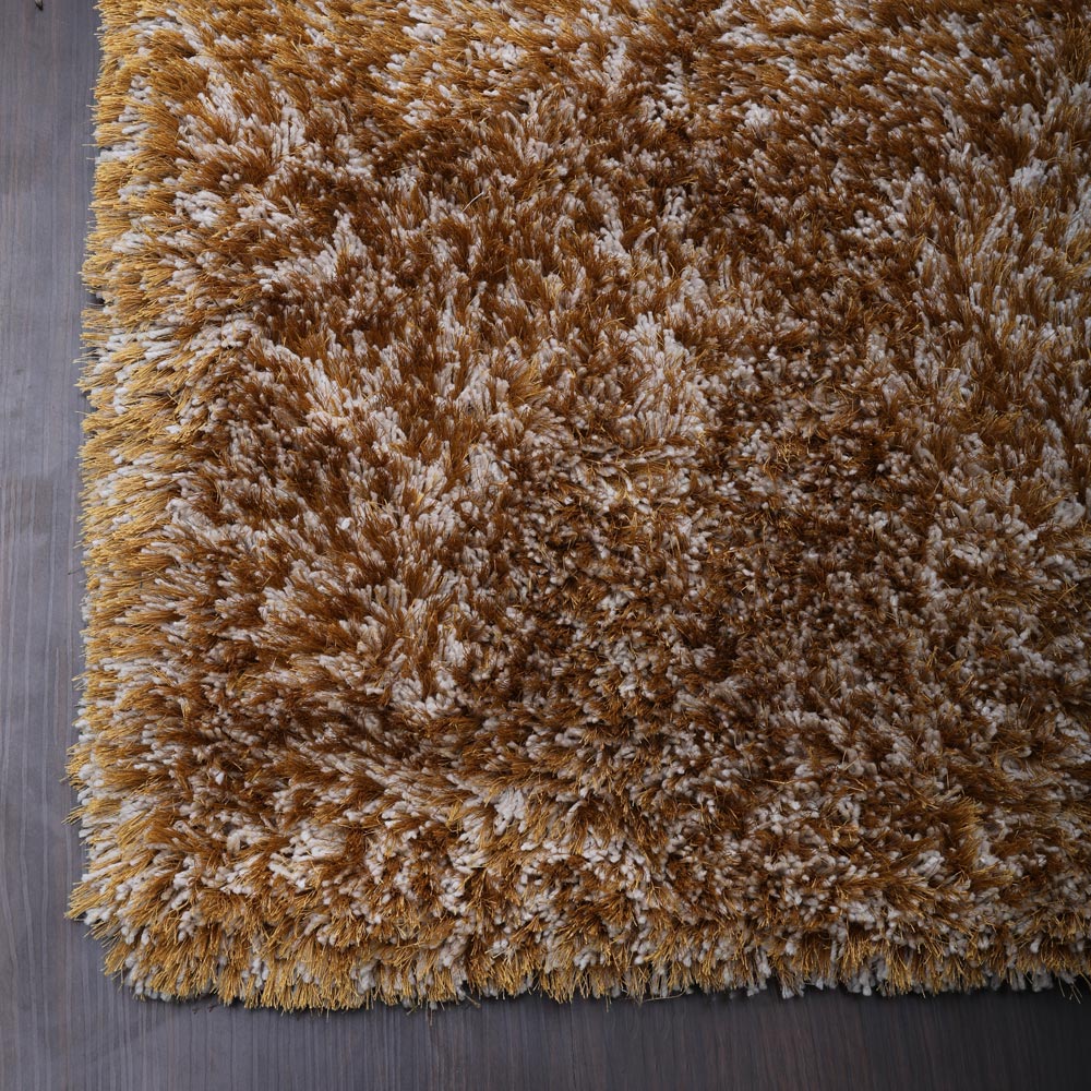 hand-tufted-shag-polyester-area-rug-solid-gold-closeup 1