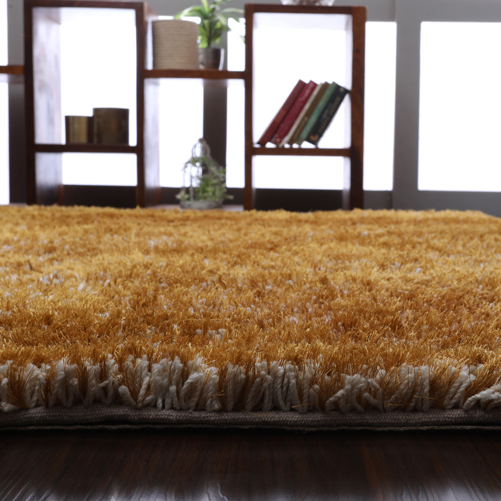 hand-tufted-shag-polyester-area-rug-solid-gold-closeup 3