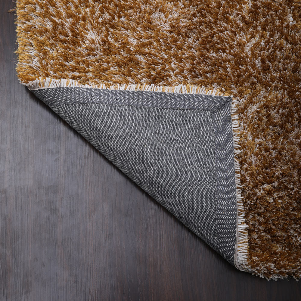 hand-tufted-shag-polyester-area-rug-solid-gold-closeup 5