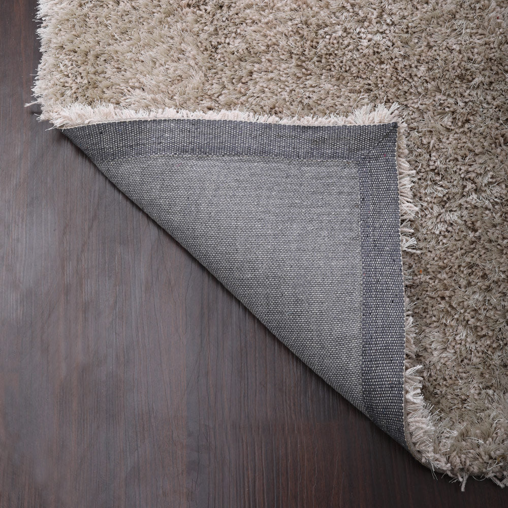 hand-tufted-shag-polyester-area-rug-solid-ivory-closeup-5