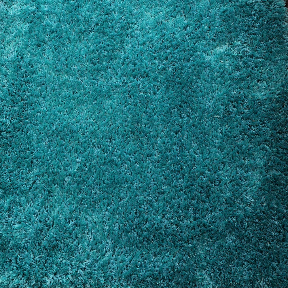 hand-tufted-shag-polyester-solid-turquoise-rectangle-rug-closeup-1