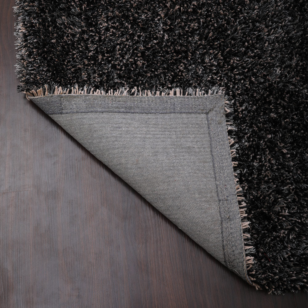 hand-tufted-shag-polyester-area-rug-solid-black-silver-closeup 5