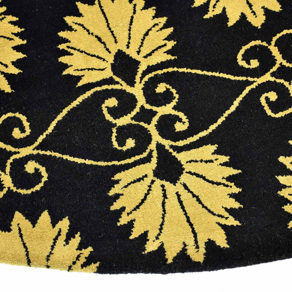 hand-tufted-wool-round-area-rug-floral-black-gold-closeup 1