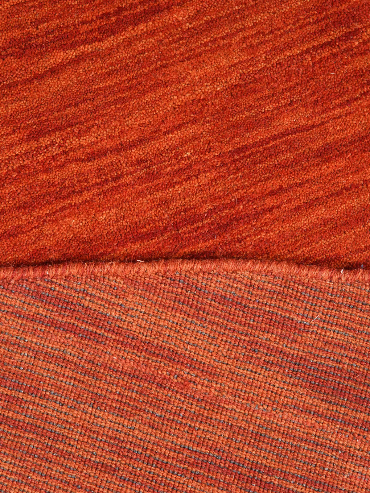 hand-knotted-loom-wool-solid-light-red-round-rug-closeup-4