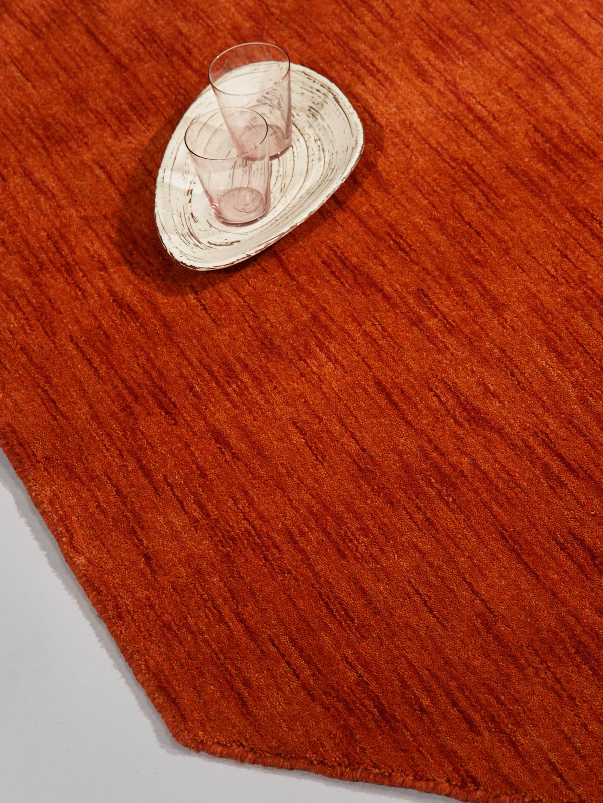 hand-knotted-loom-wool-solid-light-red-octagon-rug-closeup-3