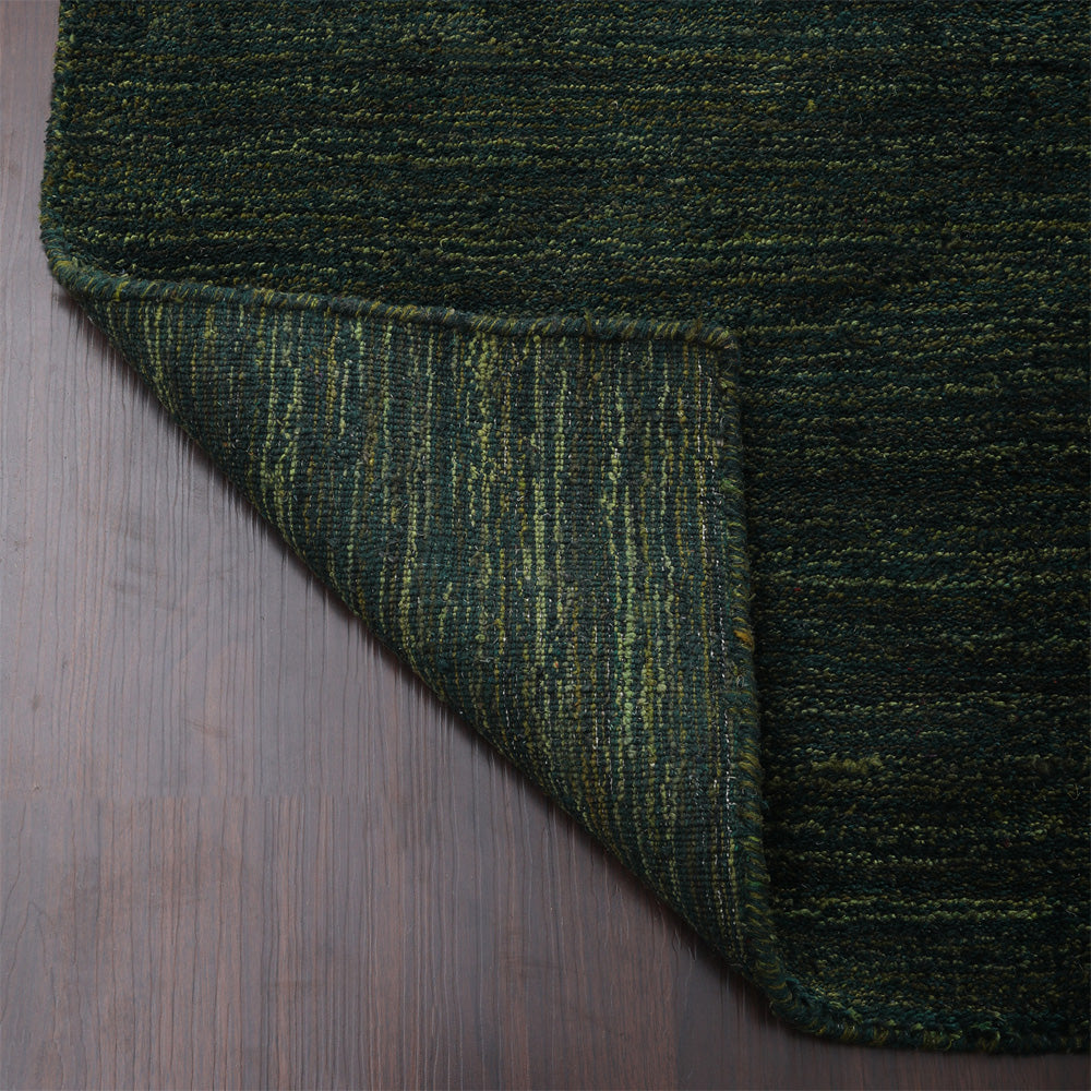 hand-knotted-loom-silk-rectangle-area-rug-solid-dark-green-closeup 5
