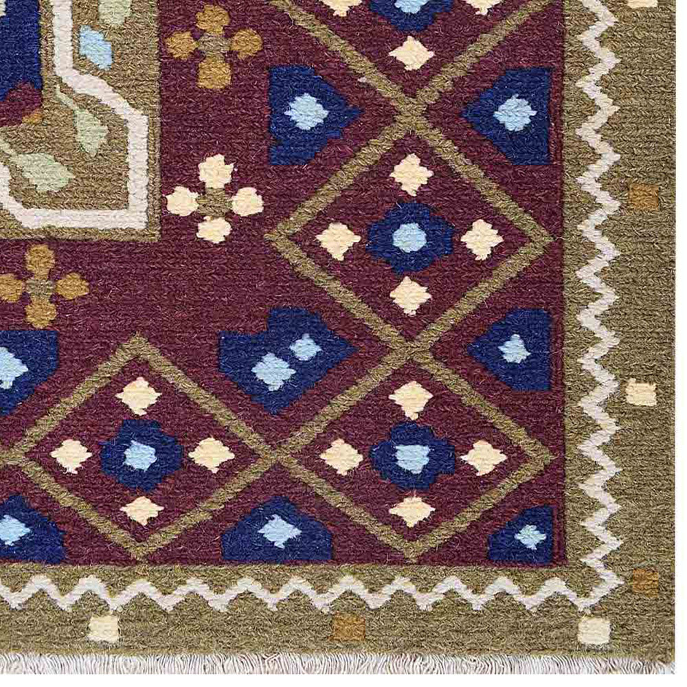 hand-knotted-sumak-blue-rust-oriental-rug-closeup-1