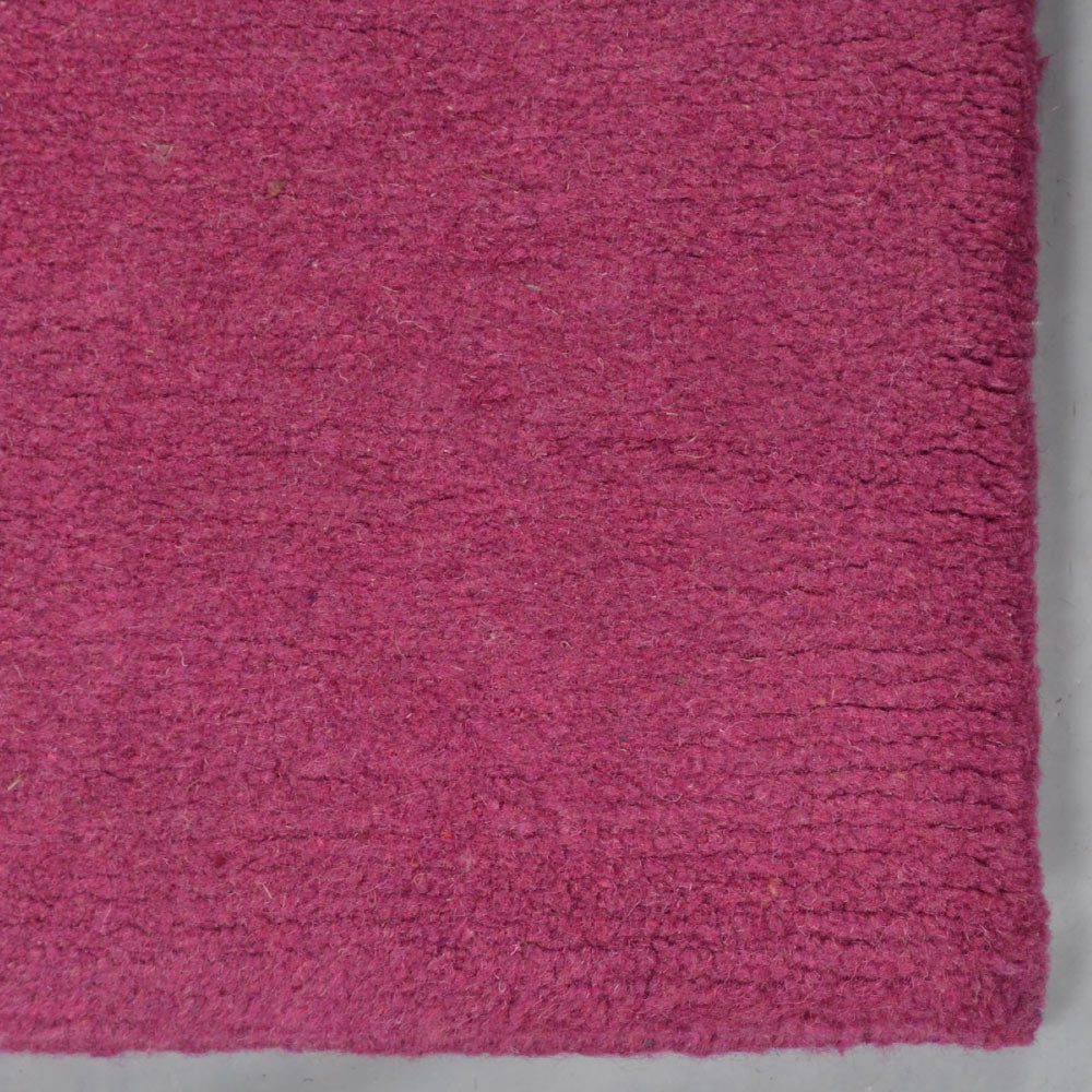 hand-knotted-tibbati-wool-area-rug-solid-pink-closeup-2