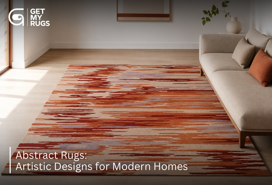 Abstract area rug with painterly terracotta, rust, and lavender brushstroke pattern filling a bright minimalist living room