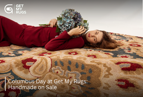 Model reclining on a traditional camel and burgundy medallion rug holding blue hydrangeas, for Columbus Day sale