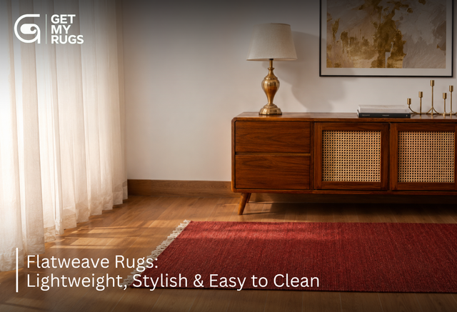 Deep red fringed flatweave kilim runner rug on a wood floor beside a mid-century wooden sideboard
