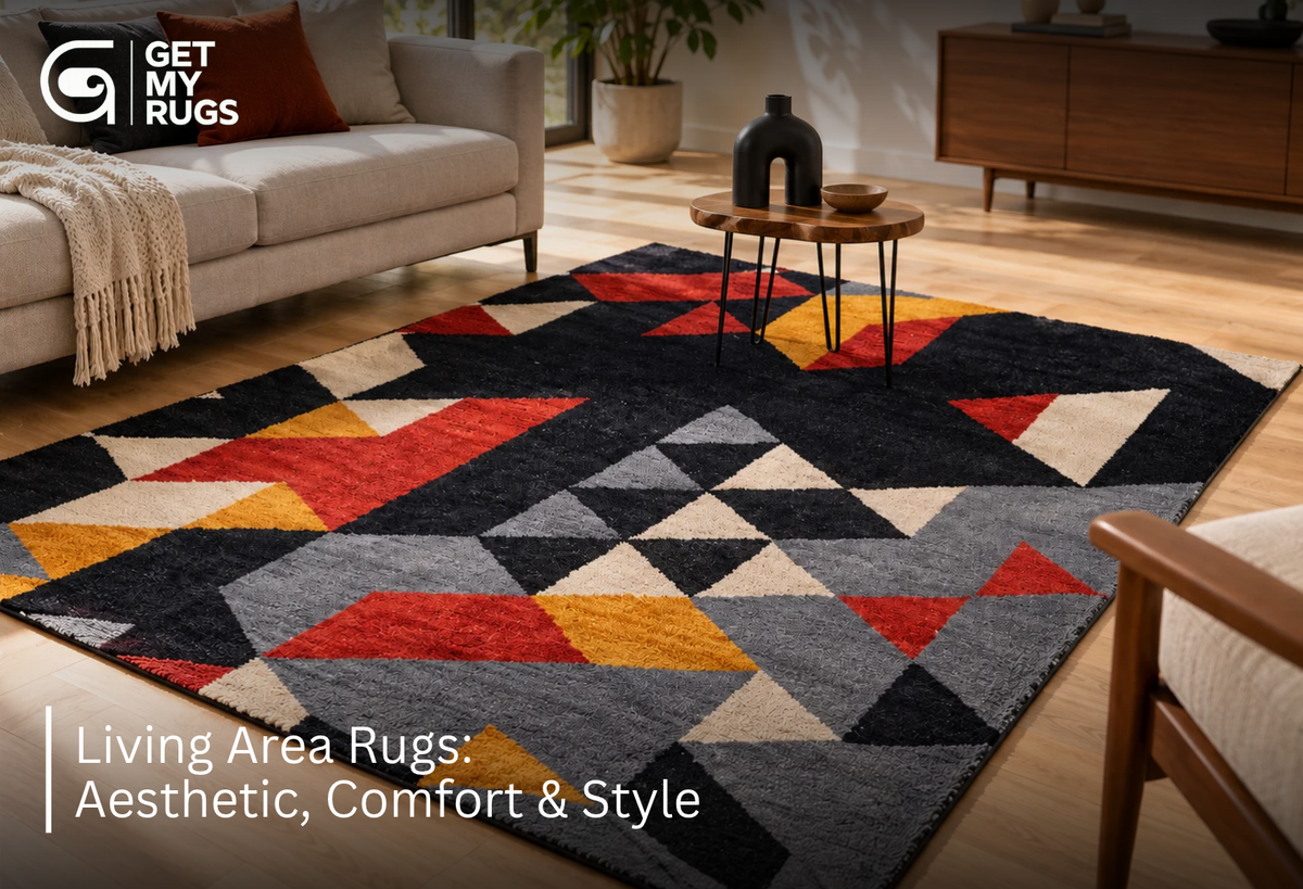 Bold geometric black, red, and mustard area rug anchoring a modern living room seating arrangement