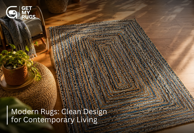 Hand-braided modern area rug in blue and camel tones styled in a warm, sunlit boho-modern living room corner