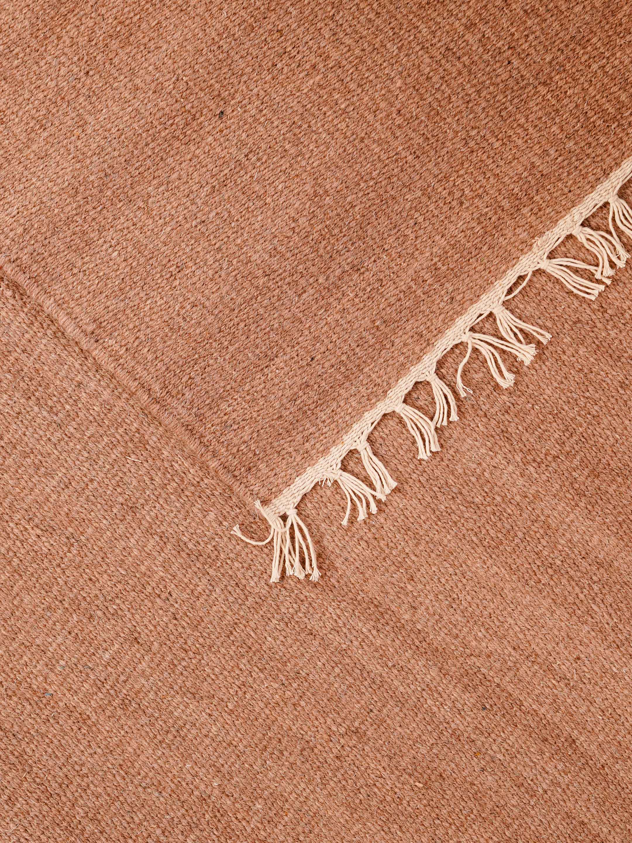 hand-woven-flat-weave-wool-solid-light-brown-rug-closeup-4