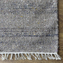 hand-woven-flat-weave-polyester-solid-beige-rug-closeup-2