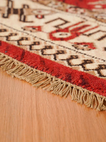 Handmade Red and Cream Wool Area Rug