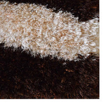 hand-tufted-shag-polyester-area-rug-contemporary-ivory-brown-closeup 1