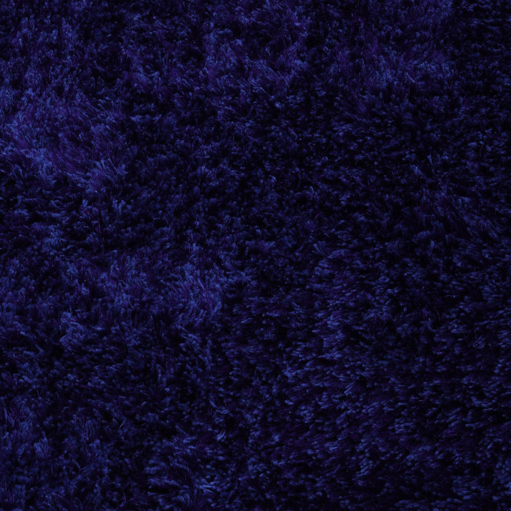 hand-tufted-shag-polyester-area-rug-solid-blue-closeup 1