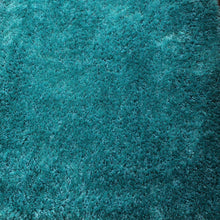hand-tufted-shag-polyester-solid-turquoise-rectangle-rug-closeup-1