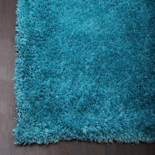 hand-tufted-shag-polyester-solid-turquoise-rectangle-rug-closeup-2