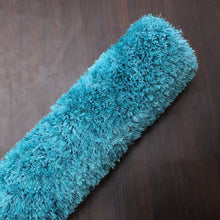 hand-tufted-shag-polyester-solid-turquoise-rectangle-rug-closeup-4