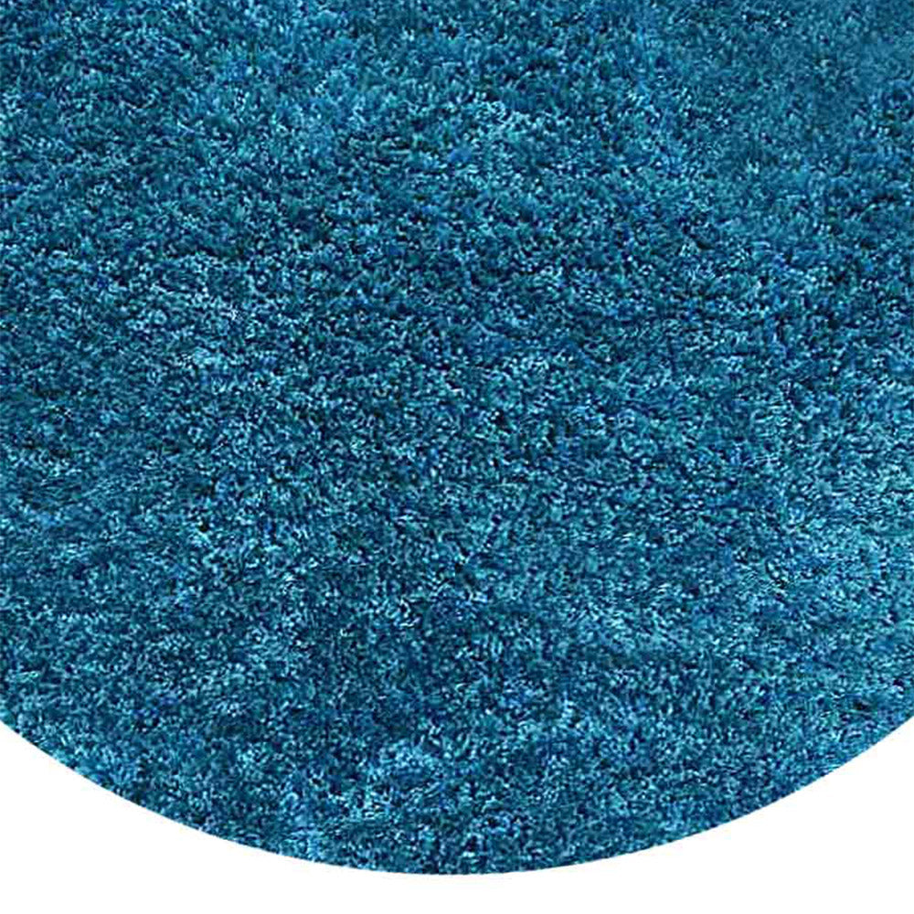 hand-tufted-shag-polyester-solid-turquoise-round-rug-closeup-1