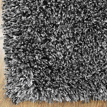 hand-tufted-shag-polyester-area-rug-solid-black-white-closeup 1
