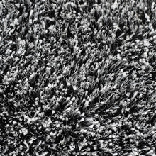 hand-tufted-shag-polyester-area-rug-solid-black-white-closeup 2