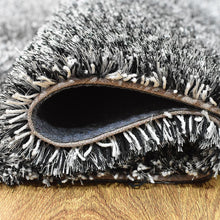 hand-tufted-shag-polyester-area-rug-solid-black-white-closeup 3