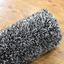 hand-tufted-shag-polyester-area-rug-solid-black-white-closeup 5