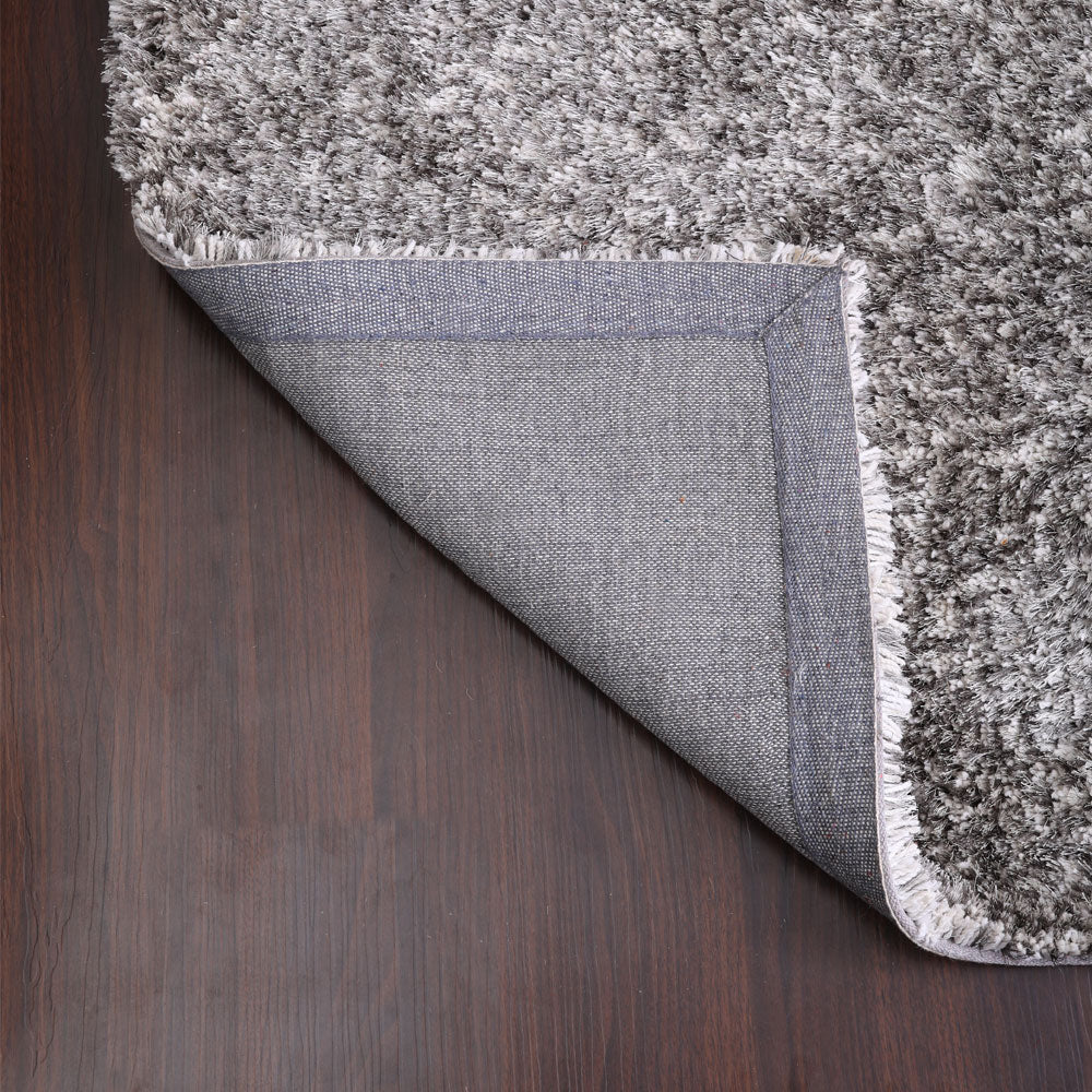 hand-tufted-shag-polyester-solid-gray-white-rectangle-rug-closeup-5