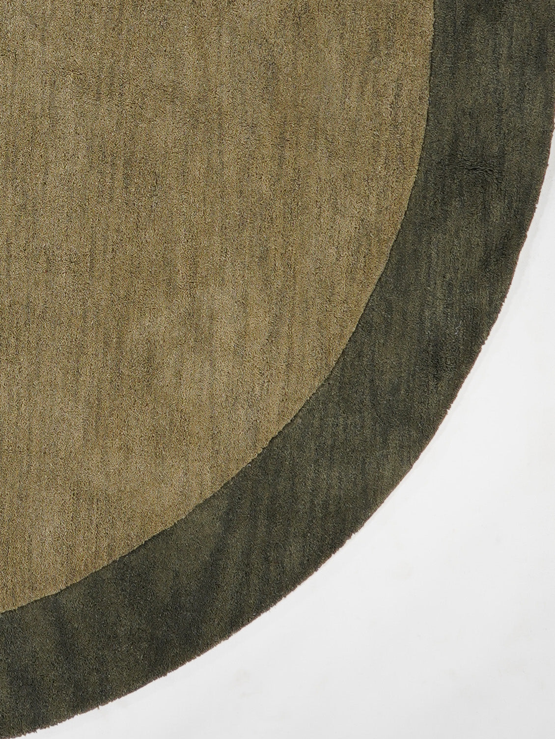 hand-knotted-wool-contemporary-green-round-rug-closeup-1