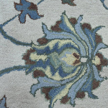 hand-knotted-wool-floral-cream-round-rug-closeup-1