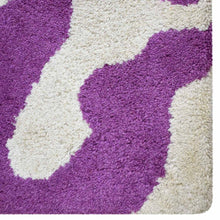 hand-tufted-wool-area-rug-abstract-cream-purple-closeup 1