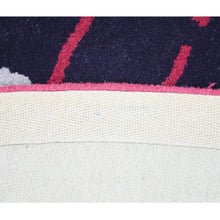hand-tufted-wool-round-area-rug-contemporary-multicolor-closeup 3