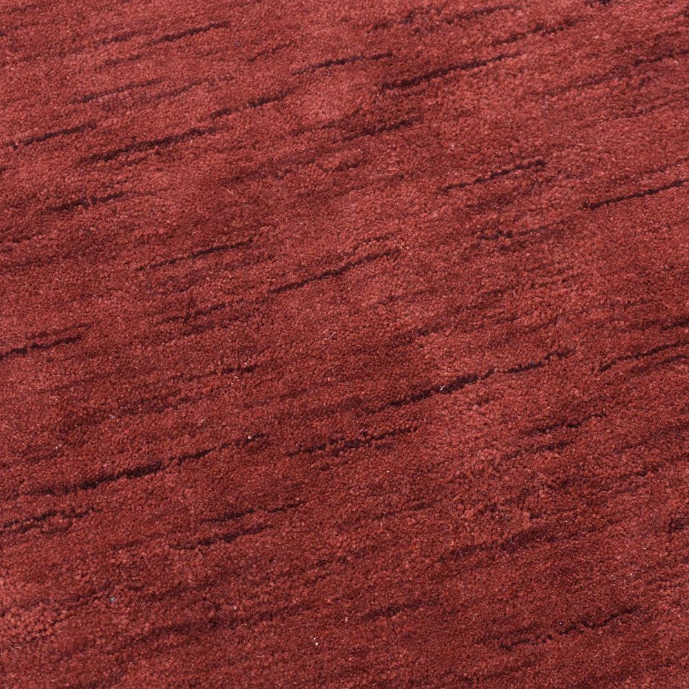 hand-knotted-loom-wool-solid-red-octagon-rug-closeup-1