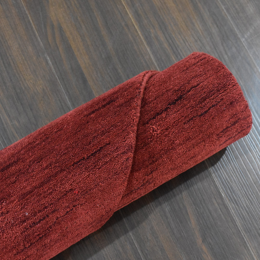 hand-knotted-loom-wool-solid-red-octagon-rug-closeup-6