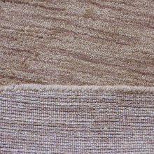 hand-knotted-loom-wool-solid-light-brown-round-rug-closeup-3