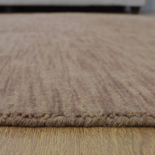 hand-knotted-loom-wool-solid-light-brown-round-rug-closeup-4