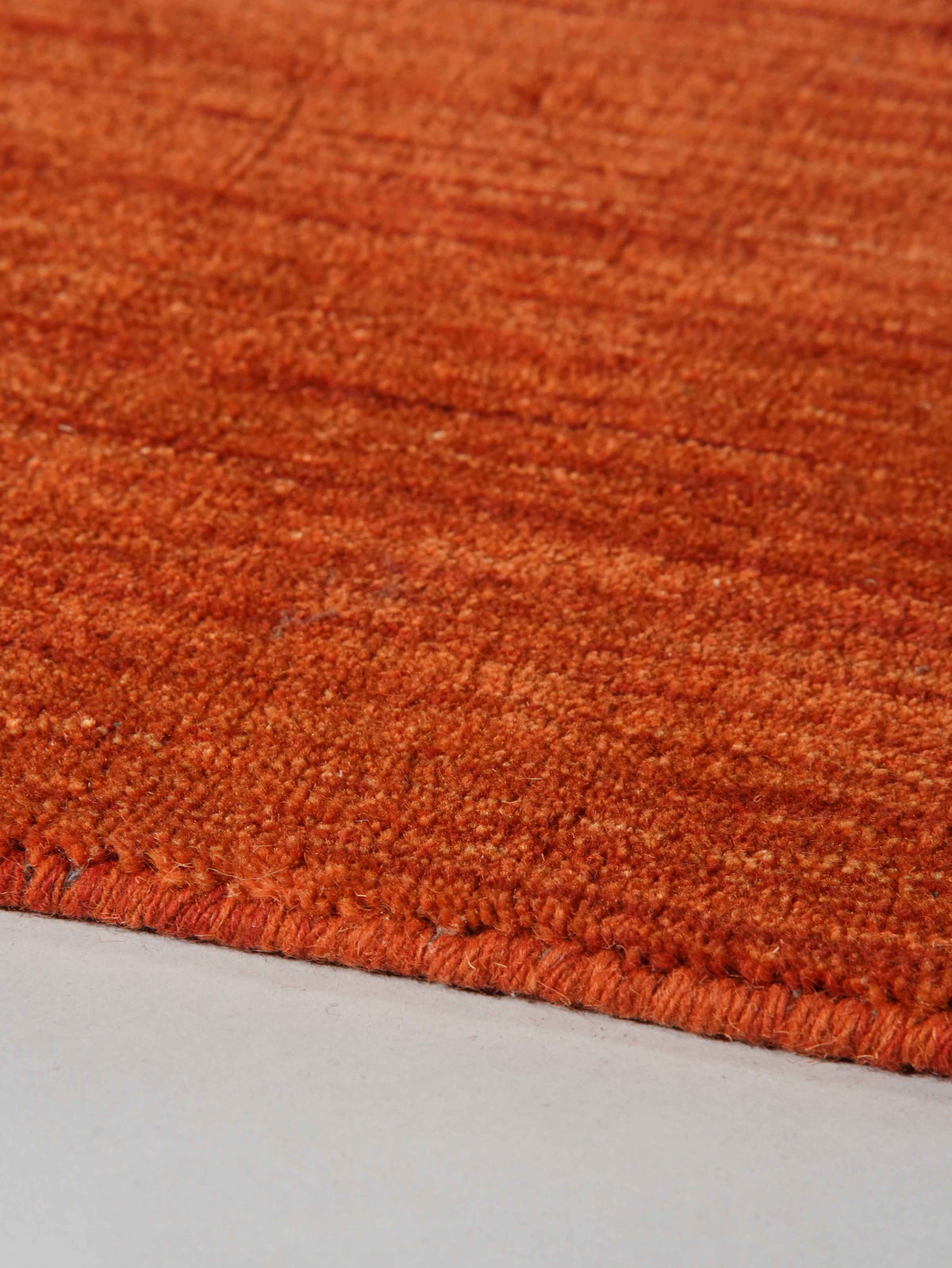 hand-knotted-loom-wool-solid-light-red-rug-closeup-2