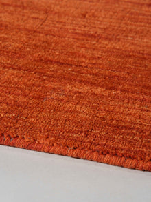 hand-knotted-loom-wool-solid-light-red-rug-closeup-2