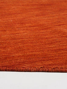 hand-knotted-loom-wool-solid-light-red-round-rug-closeup-3