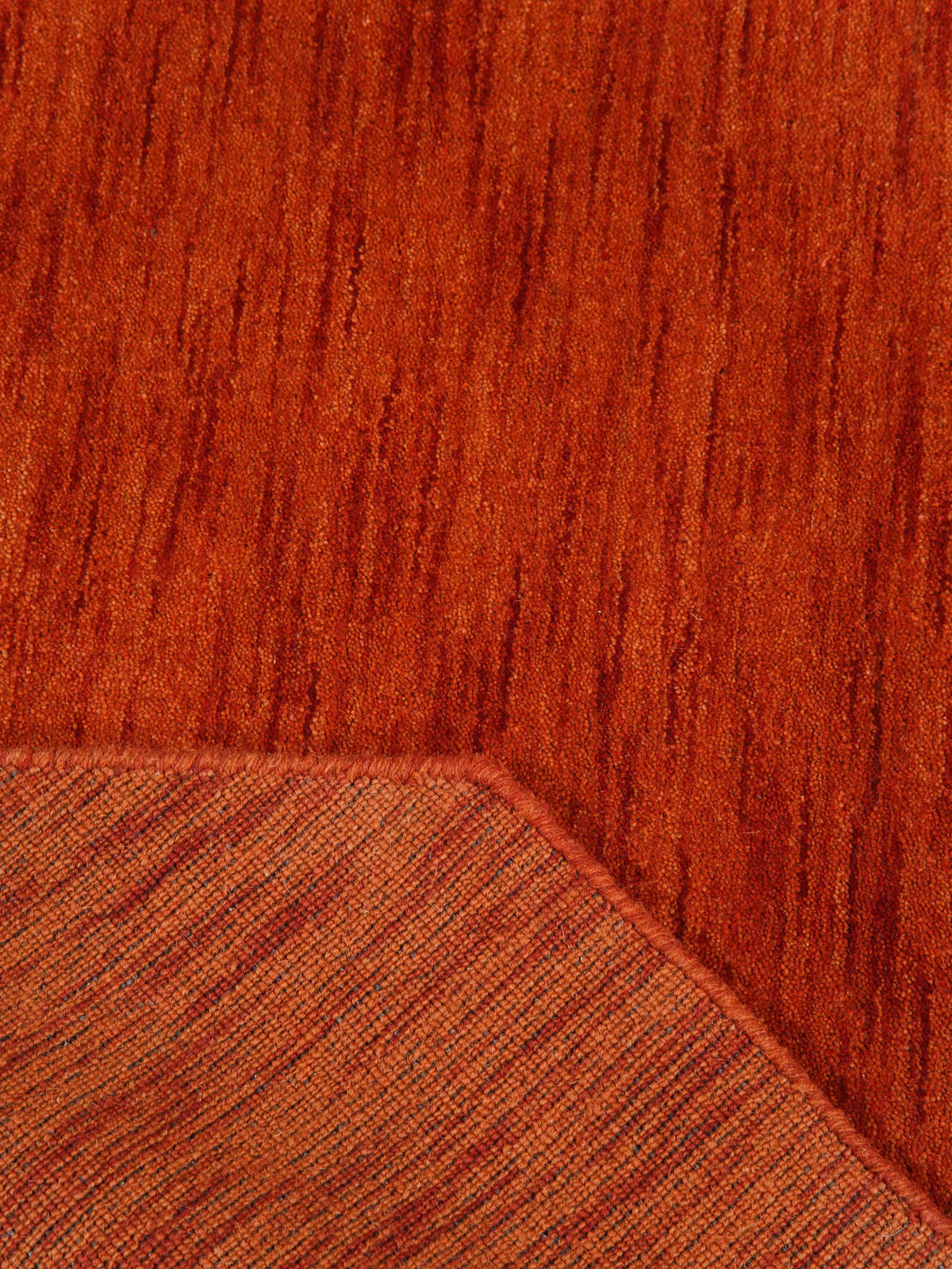 hand-knotted-loom-wool-solid-light-red-octagon-rug-closeup-4