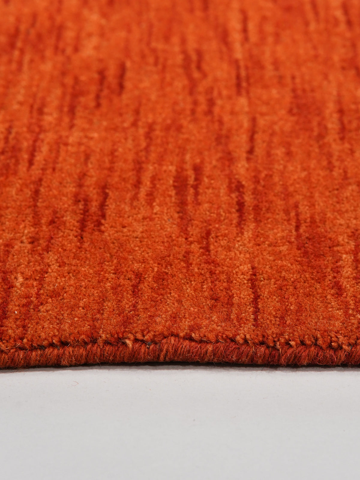 hand-knotted-loom-wool-solid-light-red-octagon-rug-closeup-5