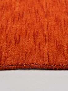 hand-knotted-loom-wool-solid-light-red-octagon-rug-closeup-5