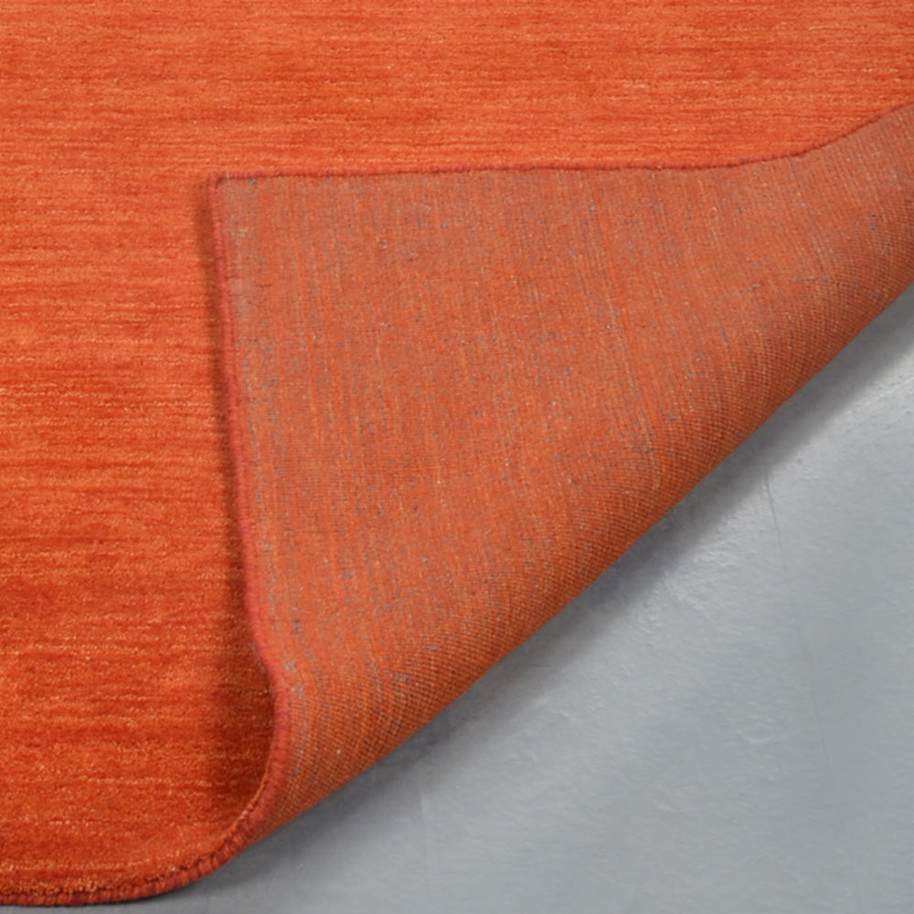 hand-knotted-loom-wool-area-rug-contemporary-rust-closeup 1